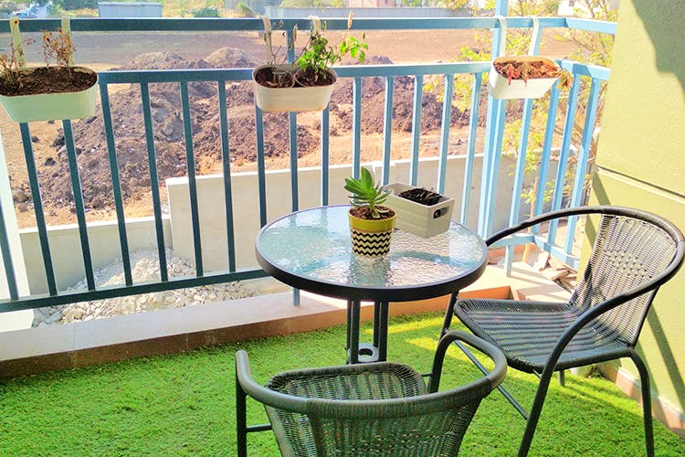 Green,Furniture,Table,Property,Iron,Chair,Outdoor table,Room,Balcony,Real estate
