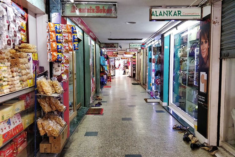 Aisle,Building,Retail,Market,Convenience store,Marketplace,Street,Urban area,Shopping,City