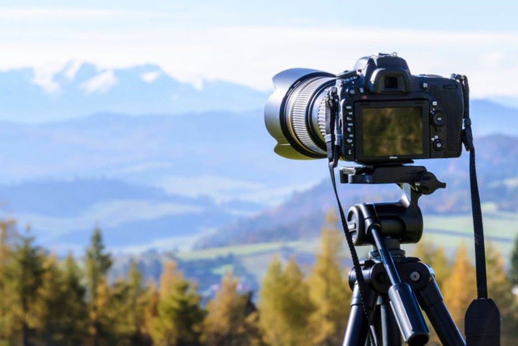 Camera accessory,Cameras & optics,Tripod,Filmmaking,Sky,Lens,Photography,Camera lens,Camera,Camera operator