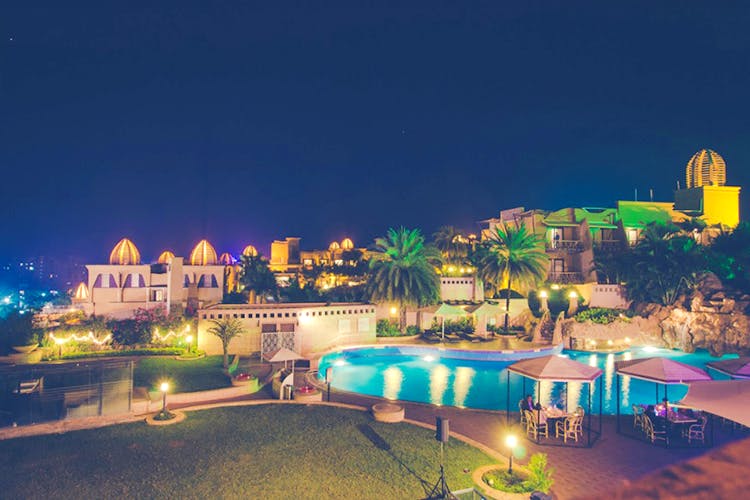 Town,Lighting,Building,Resort,Night,Tourism,Sky,Resort town,Estate,Real estate