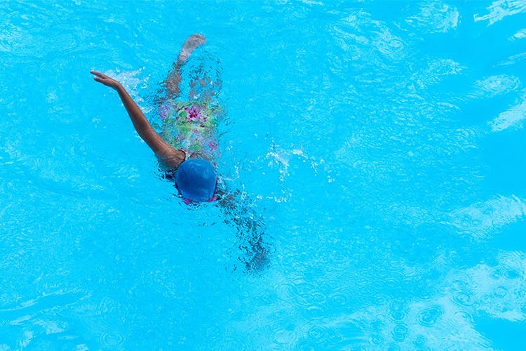 Swimming,Water,Swimmer,Blue,Swimming pool,Recreation,Leisure,Fun,Azure,Individual sports