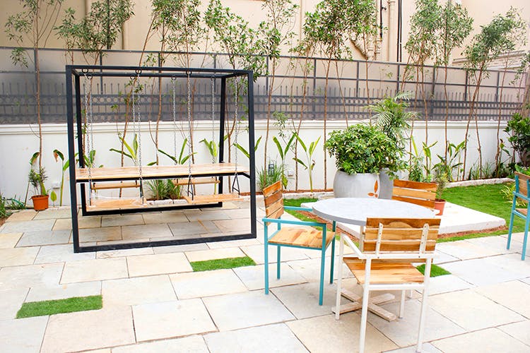 Furniture,Property,Room,Table,Houseplant,Interior design,Patio,House,Building,Plant