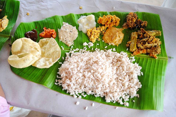 Dish,Food,Cuisine,Sadya,Banana leaf rice,Ingredient,Rice,Andhra food,Banana leaf,Leaf