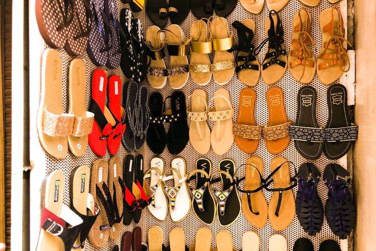 Footwear,Shoe,Shoe store,Slipper,Retail,Collection,Sandal,Selling,Building