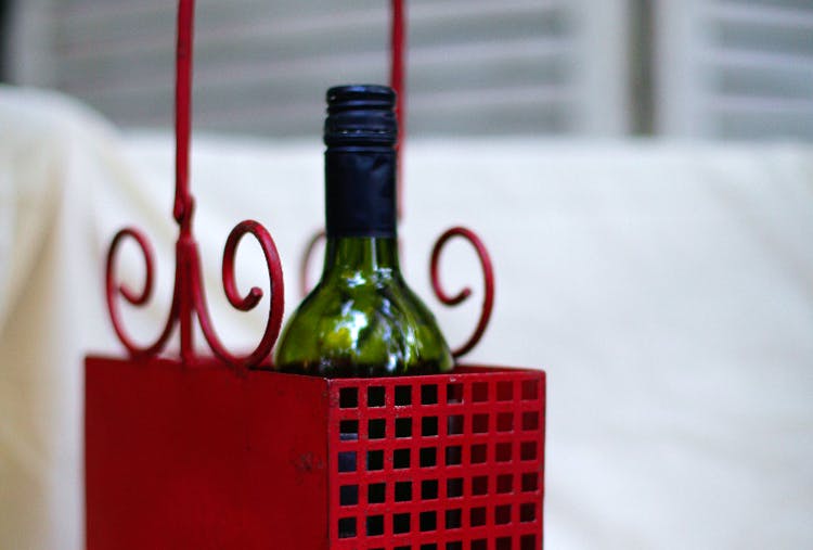 Bottle,Red,Wine bottle,Green,Glass bottle,Alcohol,Drink,Liqueur,Glass,Tableware