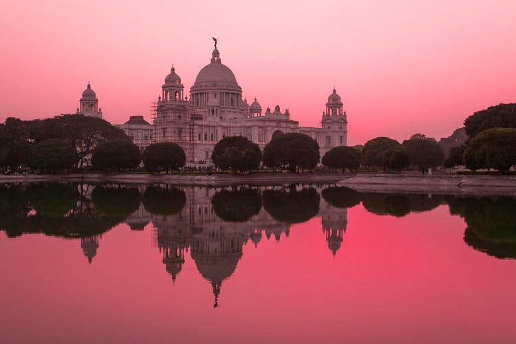 Reflection,Landmark,Reflecting pool,Pink,Sky,Water,Architecture,Historic site,Morning,Tourist attraction