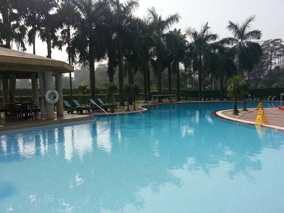 Swimming pool,Resort,Property,Vacation,Leisure,Sky,Water,Tree,Palm tree,Resort town