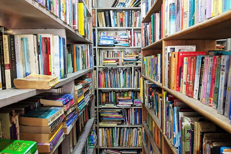 Shelving,Bookcase,Shelf,Library,Book,Public library,Bookselling,Publication,Furniture,Building