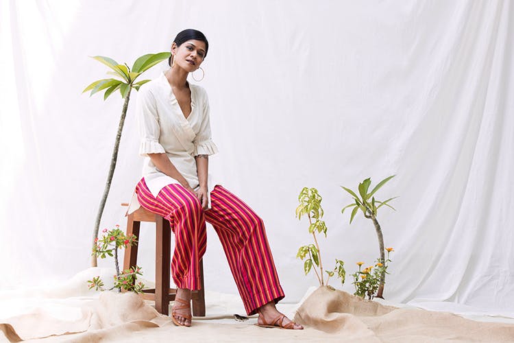 White,Clothing,Pink,Sitting,Textile,Trousers,Waist,Pajamas,Plant,Photo shoot