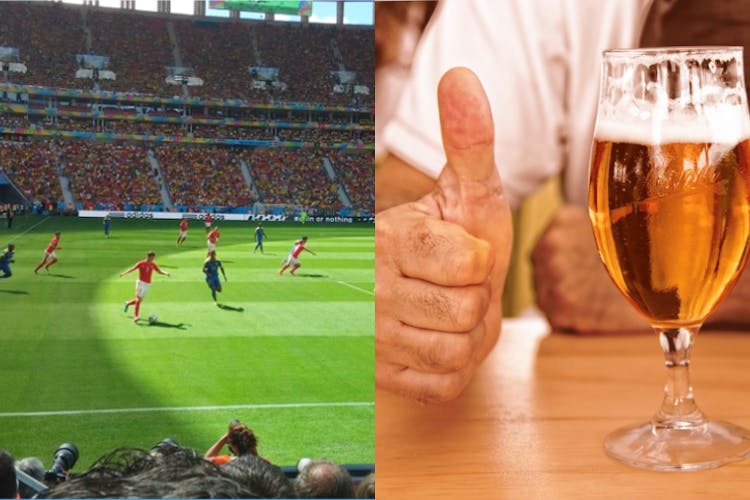 Alcohol,Sport venue,Drink,Beer glass,Beer,Grass,Alcoholic beverage,Stadium,Hand,Drinkware