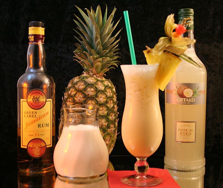 Alcoholic beverage,Drink,Liqueur,Distilled beverage,Piña colada,Alcohol,Bottle,Pineapple,Glass bottle,Cocktail garnish