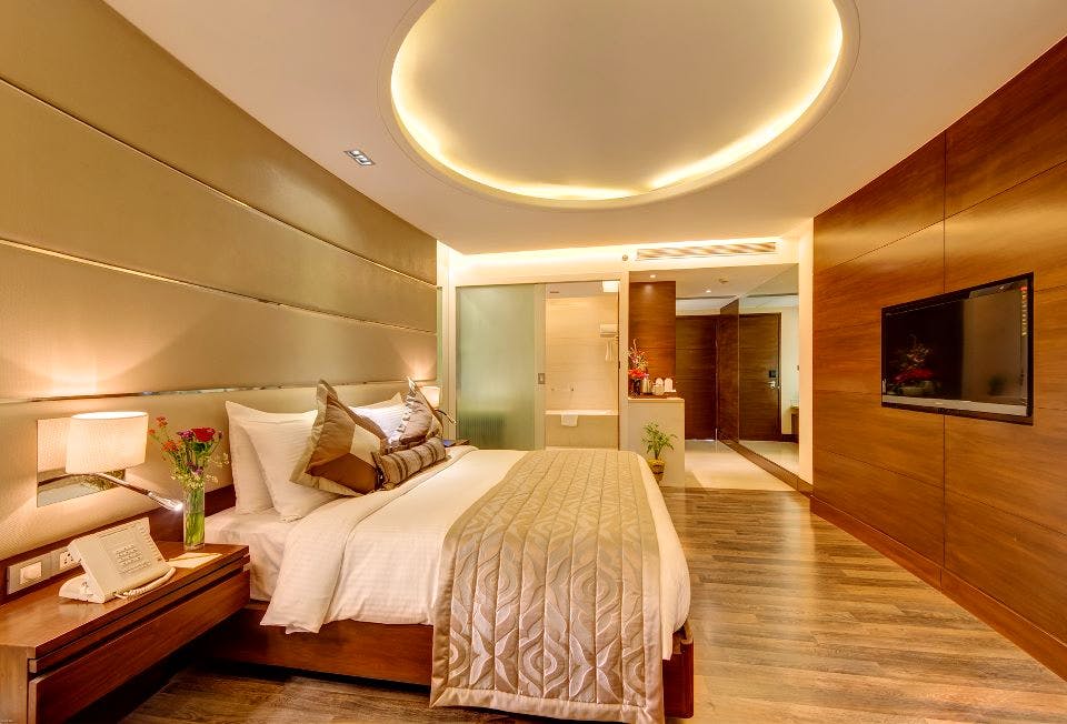 Bedroom,Room,Furniture,Interior design,Property,Ceiling,Bed,Building,Floor,Bed frame