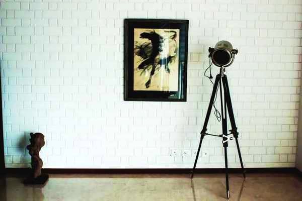 Wall,Tripod,Picture frame,Cameras & optics,Camera accessory,Photography,Art,Easel,Visual arts,Room