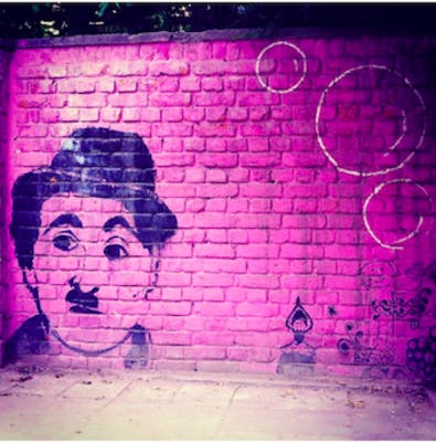 Pink,Wall,Purple,Street art,Text,Head,Art,Sky,Brick,Violet