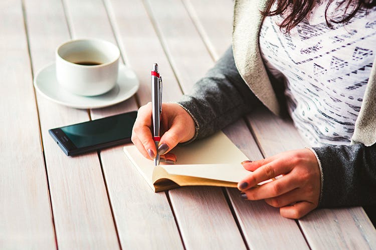 Table,Wood,Writing,Hand,Writing instrument accessory,Finger,Furniture,Wood stain,Sitting,Floor