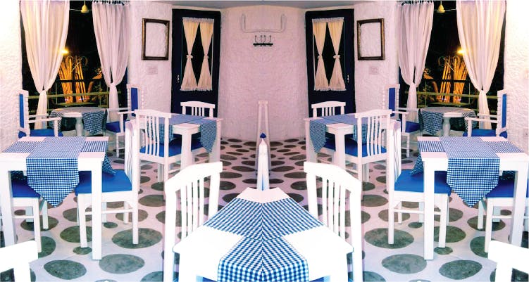 Blue,Turquoise,Restaurant,Design,Table,Architecture,Room,Chair,Furniture,Interior design