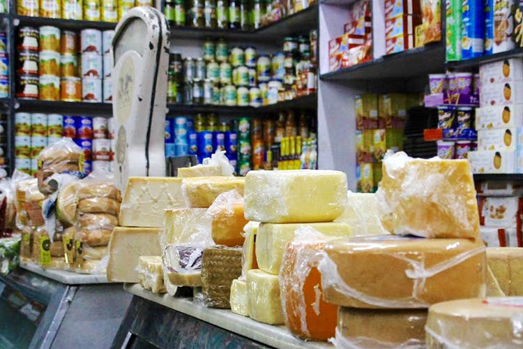 Food,Cheesemaking,Dairy,Montasio,Market,Grocery store,Delicacy,Cheese,Confectionery,Ingredient