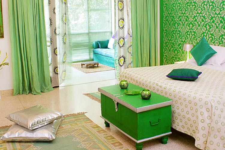 Green,Room,Furniture,Interior design,Turquoise,Curtain,Table,Living room,Property,Coffee table