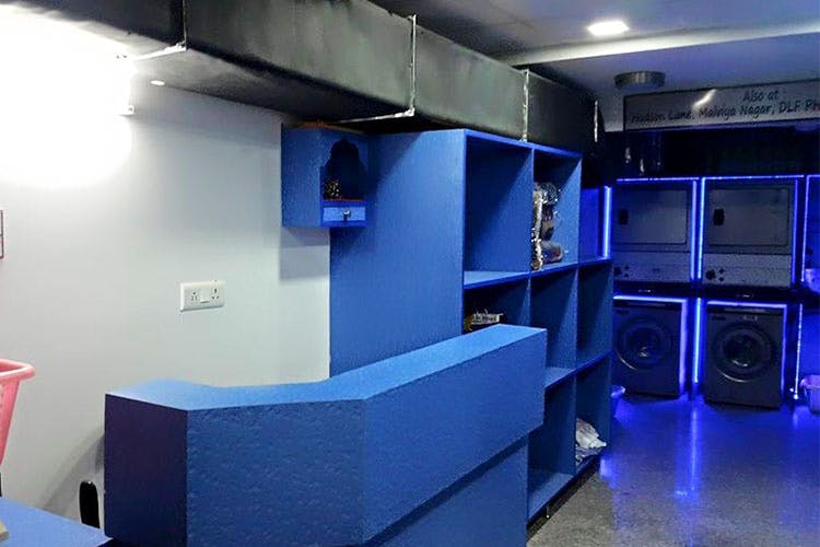 Blue,Room,Interior design,Building,Electronics,Technology,Ceiling,Architecture,Recording studio,Office