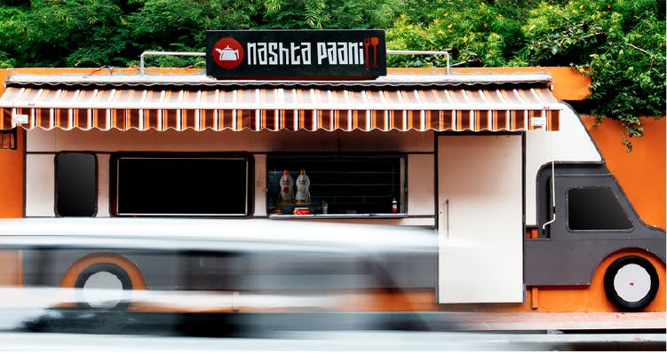 Transport,Building,Architecture,Restaurant,House,Vehicle,Fast food restaurant,Advertising,Facade,Car