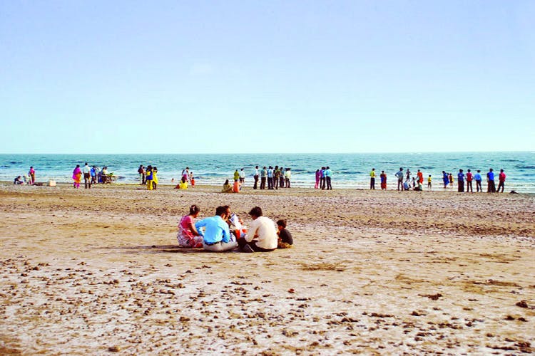 Beach,People on beach,Sand,Photograph,Sea,Vacation,Coast,Ocean,Fun,Summer