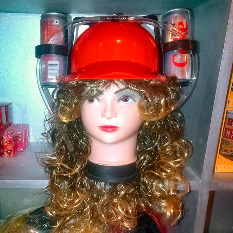 Costume hat,Wig,Costume accessory,Toy,Headgear,Hat,Helmet,Personal protective equipment,Mannequin,Fashion accessory