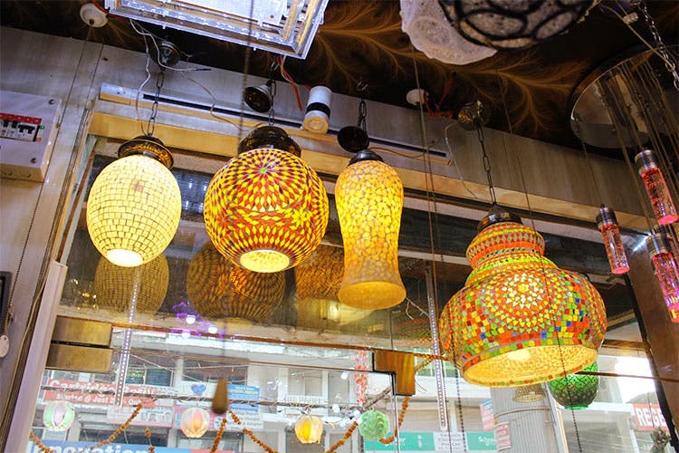 Market,Lighting,Public space,Architecture,Lighting accessory,City,Building,Bazaar,Ceiling,Lantern