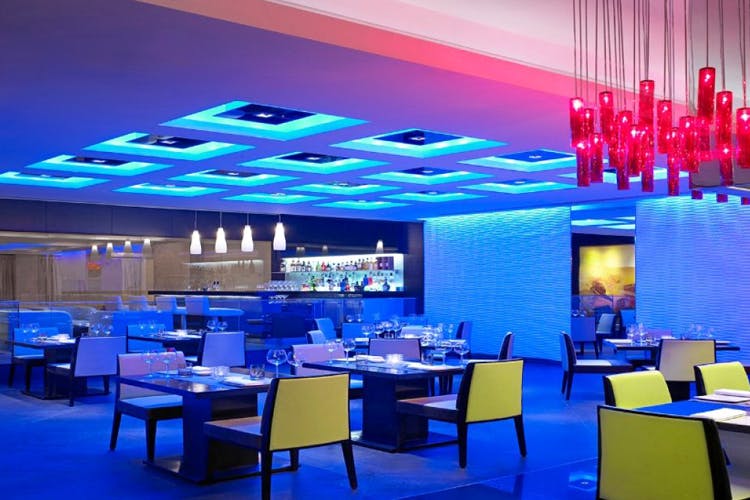 Blue,Restaurant,Lighting,Ceiling,Interior design,Building,Architecture,Design,Room,Table