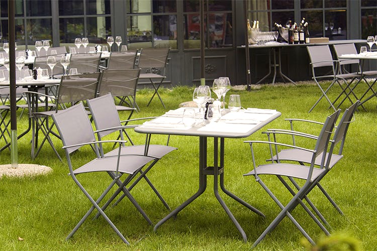 Table,Furniture,Outdoor table,Chair,Folding chair,Grass,Lawn,Outdoor furniture,Room,Event