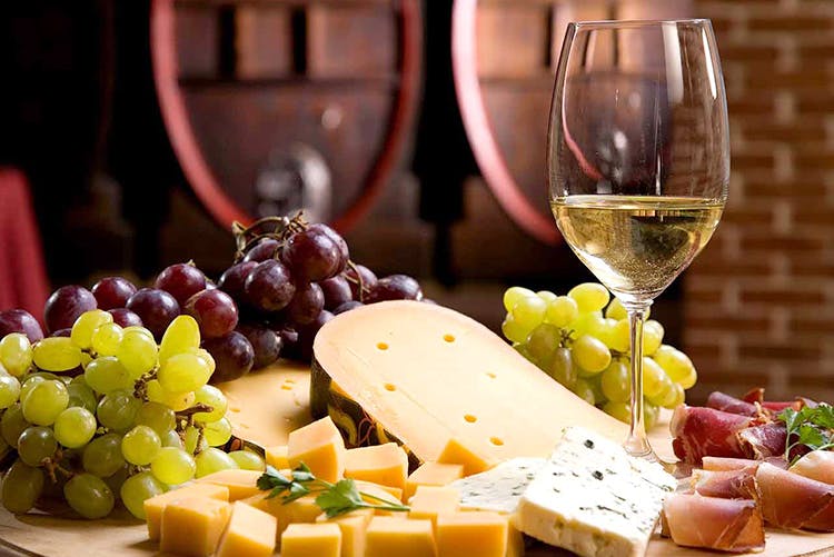 Food,Grape,Wine glass,Stemware,Cheese,Grapevine family,Wine,Ingredient,Cheddar cheese,Grana padano