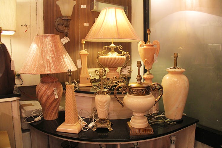 Lampshade,Lighting accessory,Lamp,Light fixture,Lighting,Interior design,Room,Antique,Table,Furniture