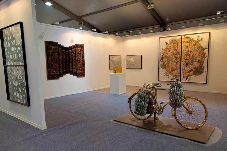 Art gallery,Exhibition,Building,Art exhibition,Art,Museum,Tourist attraction,Ceiling,Bicycle wheel,Interior design