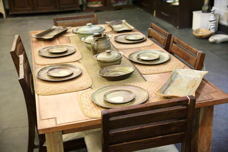 Table,Pottery,Wood,Furniture,Automotive wheel system,Ceramic,Wood stain,Porcelain,earthenware,Interior design