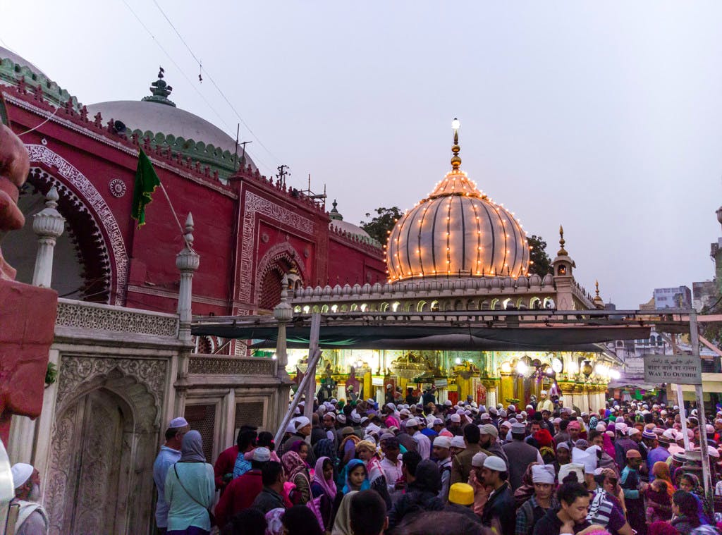 People,Crowd,Place of worship,Landmark,Hindu temple,Temple,Building,Architecture,Shrine,Temple