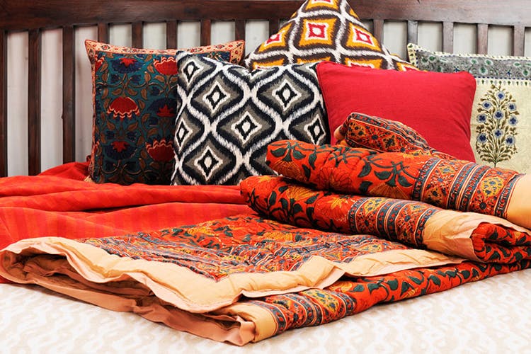 Bedding,Furniture,Orange,Textile,Cushion,Pillow,Bed sheet,Room,Linens,Throw pillow