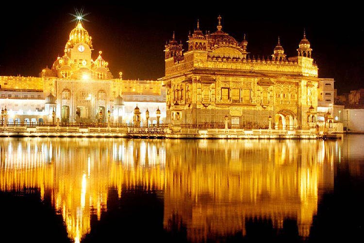 Reflection,Landmark,Night,Temple,Architecture,Place of worship,Light,Building,Hindu temple,Palace