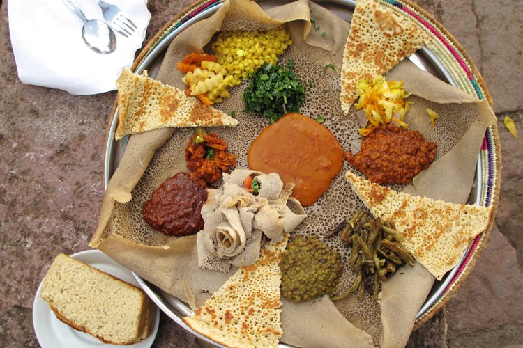 Dish,Food,Cuisine,Injera,Ingredient,Meal,Vegetarian food,Produce,Ethiopian food,Recipe