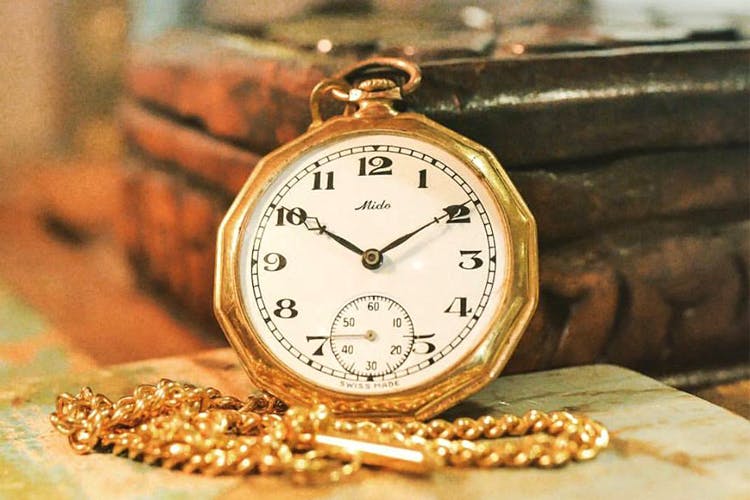 Watch,Pocket watch,Fashion accessory,Jewellery,Chain,Font,Analog watch,Still life photography,Gold,Metal