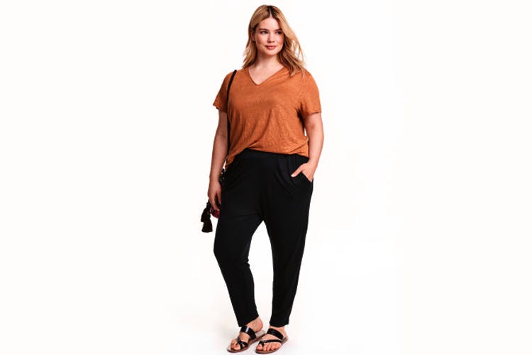 Clothing,Shoulder,Neck,sweatpant,Standing,Sleeve,Sportswear,Waist,Trousers,Brown