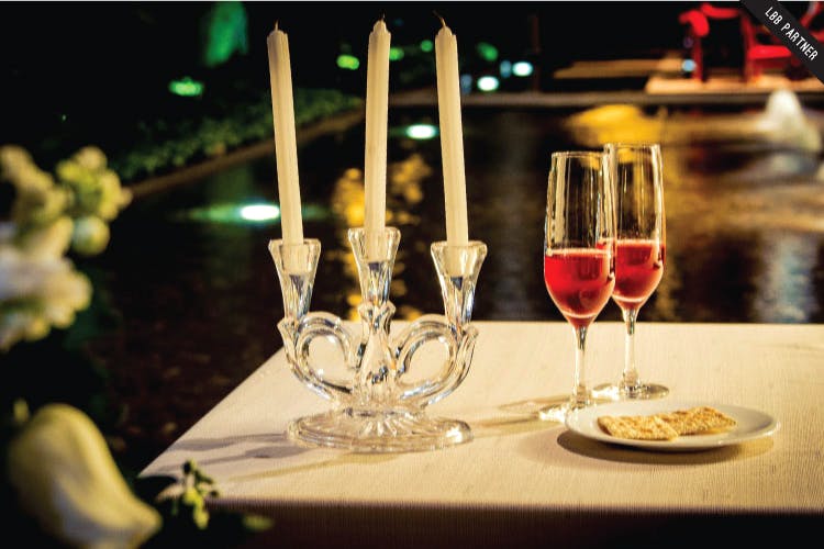 Champagne stemware,Wine glass,Stemware,Drink,Drinkware,Candle,Glass,Restaurant,Tableware,Champagne