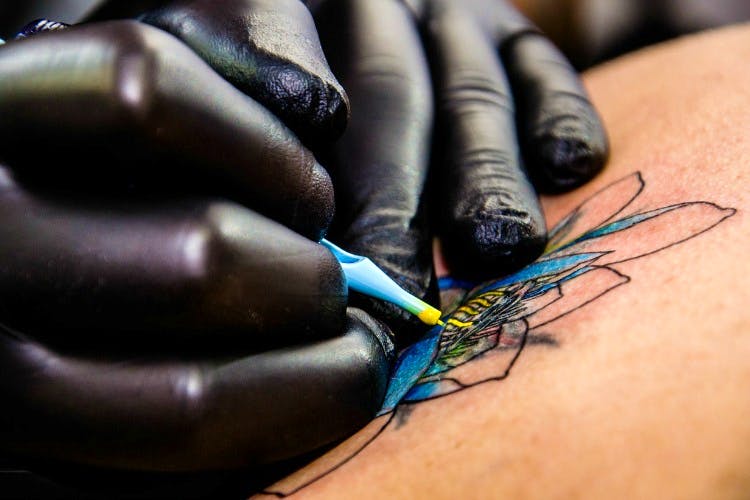 Skin,Tattoo,Hand,Finger,Close-up,Nail,Insect,Photography,Wrist,Tattoo artist