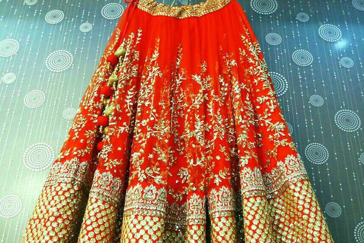 Clothing,Orange,Red,Peach,Maroon,Yellow,Textile,Dress,Pattern,Tradition