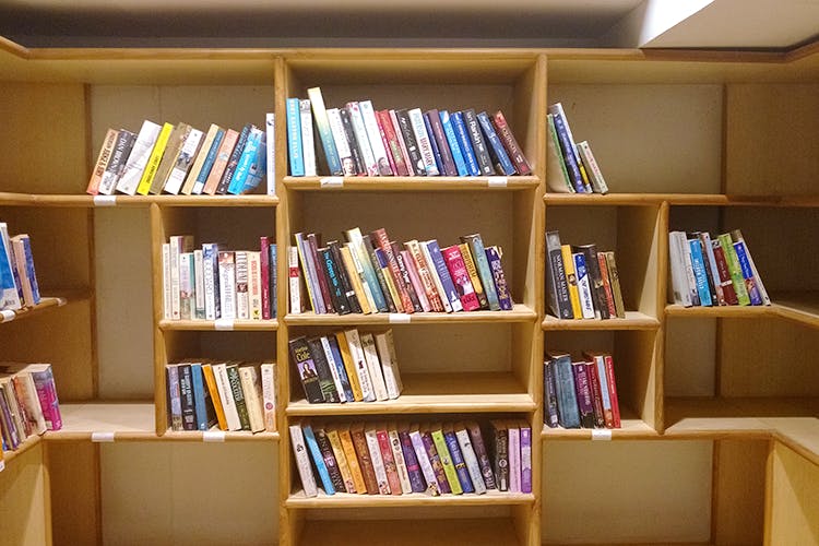 Shelving,Shelf,Bookcase,Library,Furniture,Book,Publication,Public library,Self-help book,Room