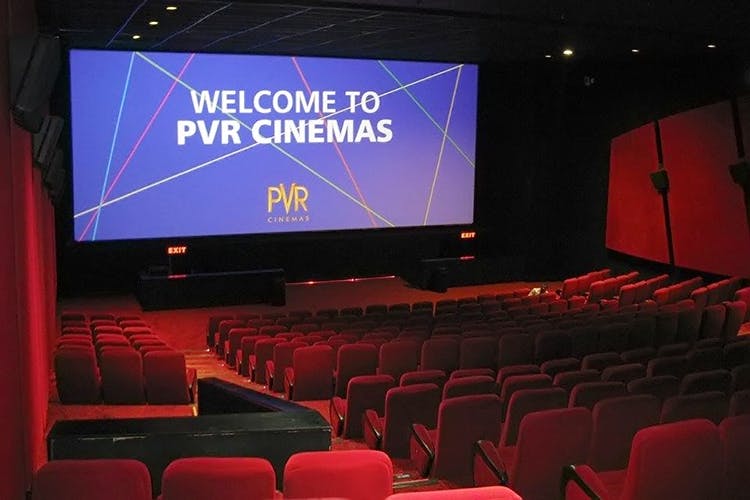 Auditorium,Projection screen,Theatre,Movie theater,Stage,heater,Convention,Building,Projector accessory,Technology