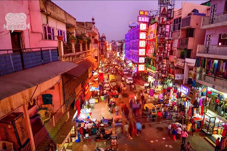 Town,Night,Human settlement,Marketplace,City,Neighbourhood,Urban area,Crowd,Street,Building