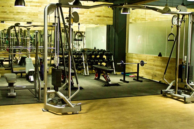 Gym,Room,Physical fitness,Weightlifting machine,Exercise machine,Sport venue,Exercise equipment,Weight training,Exercise,Flooring