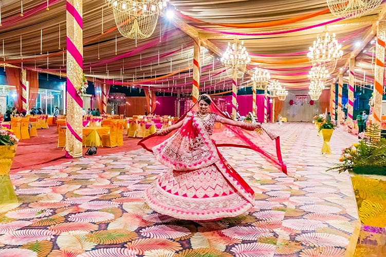 Decoration,Pink,Function hall,Lighting,Wedding reception,Event,Ceremony,Interior design,Party,Tradition
