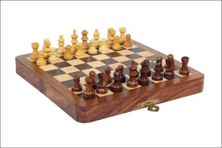 Chessboard,Games,Chess,Indoor games and sports,Board game,Recreation,Table,Sports equipment,Wood,Tabletop game