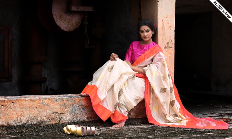 Pink,Sari,Lady,Textile,Formal wear,Temple,Photography,Performance art,Drama,Performance