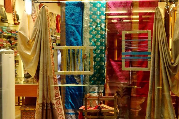 Textile,Room,Boutique,Curtain,Interior design,Bazaar,Closet,Fashion accessory,Window,Furniture